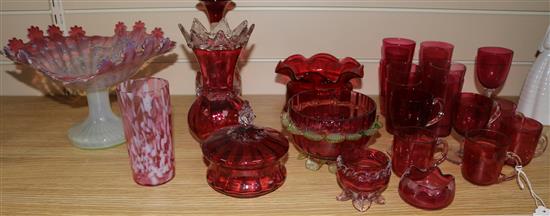A collection of cranberry glass